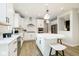 Modern white kitchen with stainless steel appliances and a large island at 5326 Noble Crossing W Pkwy, Noblesville, IN 46062