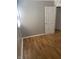 Well-lit bedroom featuring gray walls and laminate floors at 5778 E 30Th St, Indianapolis, IN 46218
