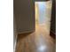 Bedroom with wood-look floors and access to bathroom at 5778 E 30Th St, Indianapolis, IN 46218