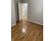 Bedroom with gray walls, laminate floors, and access to hallway at 5778 E 30Th St, Indianapolis, IN 46218