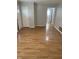 Bright and airy living area with laminate floors and access to other rooms at 5778 E 30Th St, Indianapolis, IN 46218