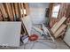 New bedroom under construction, framing and materials present at 605 Hendricks St, Anderson, IN 46016