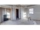 New bedroom with drywall and window, under construction at 605 Hendricks St, Anderson, IN 46016