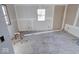 New bedroom under construction, showing unfinished walls and floors at 605 Hendricks St, Anderson, IN 46016