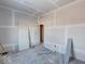 Unfinished bedroom with drywall and flooring to be installed at 605 Hendricks St, Anderson, IN 46016