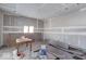 Under construction, dining room with hardwood floors and window at 605 Hendricks St, Anderson, IN 46016