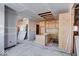 New kitchen with wood cabinets and island, under construction at 605 Hendricks St, Anderson, IN 46016