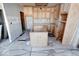 Unfinished kitchen, showing installed cabinets and island at 605 Hendricks St, Anderson, IN 46016