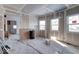 Under construction, living room with hardwood floors and windows at 605 Hendricks St, Anderson, IN 46016