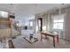Under construction, large living room with hardwood floors and staircase at 605 Hendricks St, Anderson, IN 46016