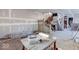 Under construction, large living room with hardwood floors and staircase at 605 Hendricks St, Anderson, IN 46016