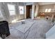Under construction, living room with hardwood floors and multiple windows at 605 Hendricks St, Anderson, IN 46016
