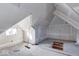 Spacious attic with sloped ceilings and potential for multiple uses at 605 Hendricks St, Anderson, IN 46016