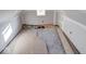 Unfinished attic room with window and high ceilings at 605 Hendricks St, Anderson, IN 46016