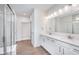 Double vanity bathroom with a large shower and linen closet at 7419 Legends Way, Whitestown, IN 46052