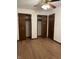 Bedroom with double closets and laminate wood floors at 7440 Hearthstone Way, Indianapolis, IN 46227