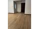 Entryway with light walls and wood-look laminate flooring at 7440 Hearthstone Way, Indianapolis, IN 46227