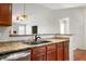 Kitchen with double sink and wood cabinets at 8815 N White Tail Trl, McCordsville, IN 46055