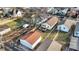 Aerial view of the backyard with a well-kept wooden deck, lawn, and private fence at 1028 Albany St, Indianapolis, IN 46203