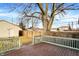 Backyard with a wooden deck and a fenced in yard at 1028 Albany St, Indianapolis, IN 46203