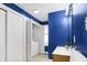 Bright bathroom featuring a laundry closet with a washer and dryer, and a single sink vanity at 1028 Albany St, Indianapolis, IN 46203