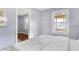 Serene bedroom bathed in natural light, seamlessly connected to an adjacent room through an open doorway at 1028 Albany St, Indianapolis, IN 46203