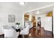 Bright dining area with table set for four, adjacent to kitchen and living room at 1028 Albany St, Indianapolis, IN 46203