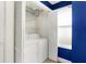 Laundry area with white washer and dryer, and a window for natural light at 1028 Albany St, Indianapolis, IN 46203