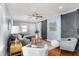 Elegant living room showcasing barn door accents, ample seating, and warm hardwood floors at 1028 Albany St, Indianapolis, IN 46203