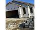 New construction home featuring an attached two-car garage and visible framing at 1089 Tomahawk Pl, Martinsville, IN 46151