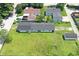 Aerial view of a home with a large, well-maintained lawn and detached garage at 1175 Central Ave, Noblesville, IN 46060