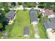 Aerial view shows a home with generous outdoor space, detached garage and established trees at 1175 Central Ave, Noblesville, IN 46060