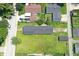 Aerial view of a residential property boasting a large, green lawn, and a detached garage at 1175 Central Ave, Noblesville, IN 46060