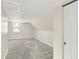 Spacious attic bedroom with gray carpet and window at 1175 Central Ave, Noblesville, IN 46060