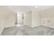 Large attic bedroom with gray carpet and access to hallway at 1175 Central Ave, Noblesville, IN 46060