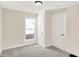 Bright bedroom with carpet, large window, and ample closet space at 1175 Central Ave, Noblesville, IN 46060
