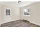 Simple bedroom with hardwood floors and a window at 1175 Central Ave, Noblesville, IN 46060