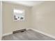 Cozy bedroom with grey carpet and a window at 1175 Central Ave, Noblesville, IN 46060