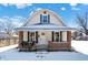 Charming house exterior with brick details and a snow covered yard at 1175 Central Ave, Noblesville, IN 46060