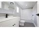 Updated bathroom with white vanity, tub, and shower at 12160 W Baker Hollow Rd, Columbus, IN 47201