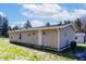 Home featuring neutral siding, a white door, and a well-maintained exterior at 12160 W Baker Hollow Rd, Columbus, IN 47201