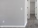 Long hallway with gray walls and wood-look floors at 12160 W Baker Hollow Rd, Columbus, IN 47201