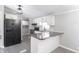 Modern kitchen with white cabinets, black appliances, and granite countertops at 12160 W Baker Hollow Rd, Columbus, IN 47201