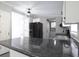 Kitchen boasts granite countertops and modern, black appliances at 12160 W Baker Hollow Rd, Columbus, IN 47201