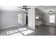 Open living room with kitchen view, gray walls and wood-look floors at 12160 W Baker Hollow Rd, Columbus, IN 47201