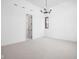 Minimalist bedroom with plush carpet, white walls, simple modern lighting, and a doorway to an ensuite bathroom at 1674 Solebar Way, Westfield, IN 46074