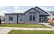 Contemporary gray home featuring a well-manicured lawn, clean lines, and modern architectural details at 1674 Solebar Way, Westfield, IN 46074