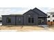 Modern home showcasing gray siding, black window frames, and clean architectural lines at 1674 Solebar Way, Westfield, IN 46074