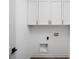 Clean white laundry room featuring upper cabinets and modern hookups at 1674 Solebar Way, Westfield, IN 46074