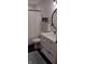 Clean bathroom with a white vanity, oval mirror, fresh white towels, and coordinated decor at 18 S Franklin St, Greenfield, IN 46140
